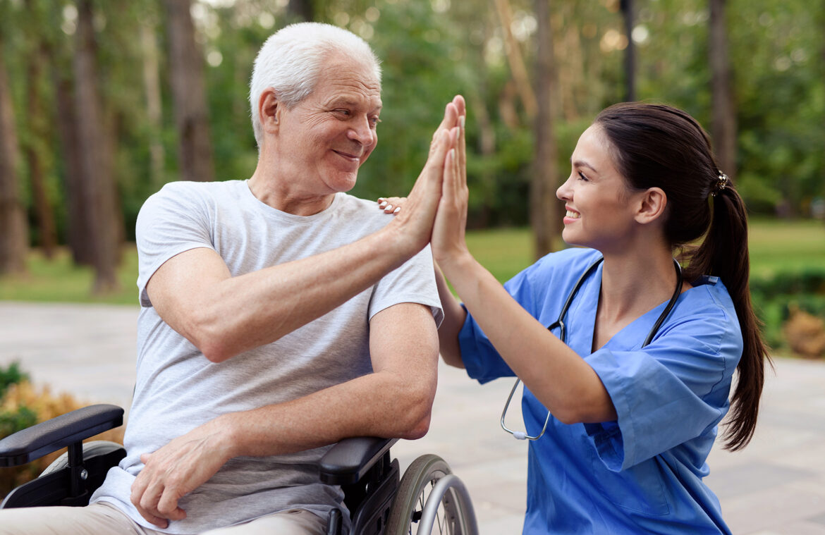 nurse old man wheelchair high five 2